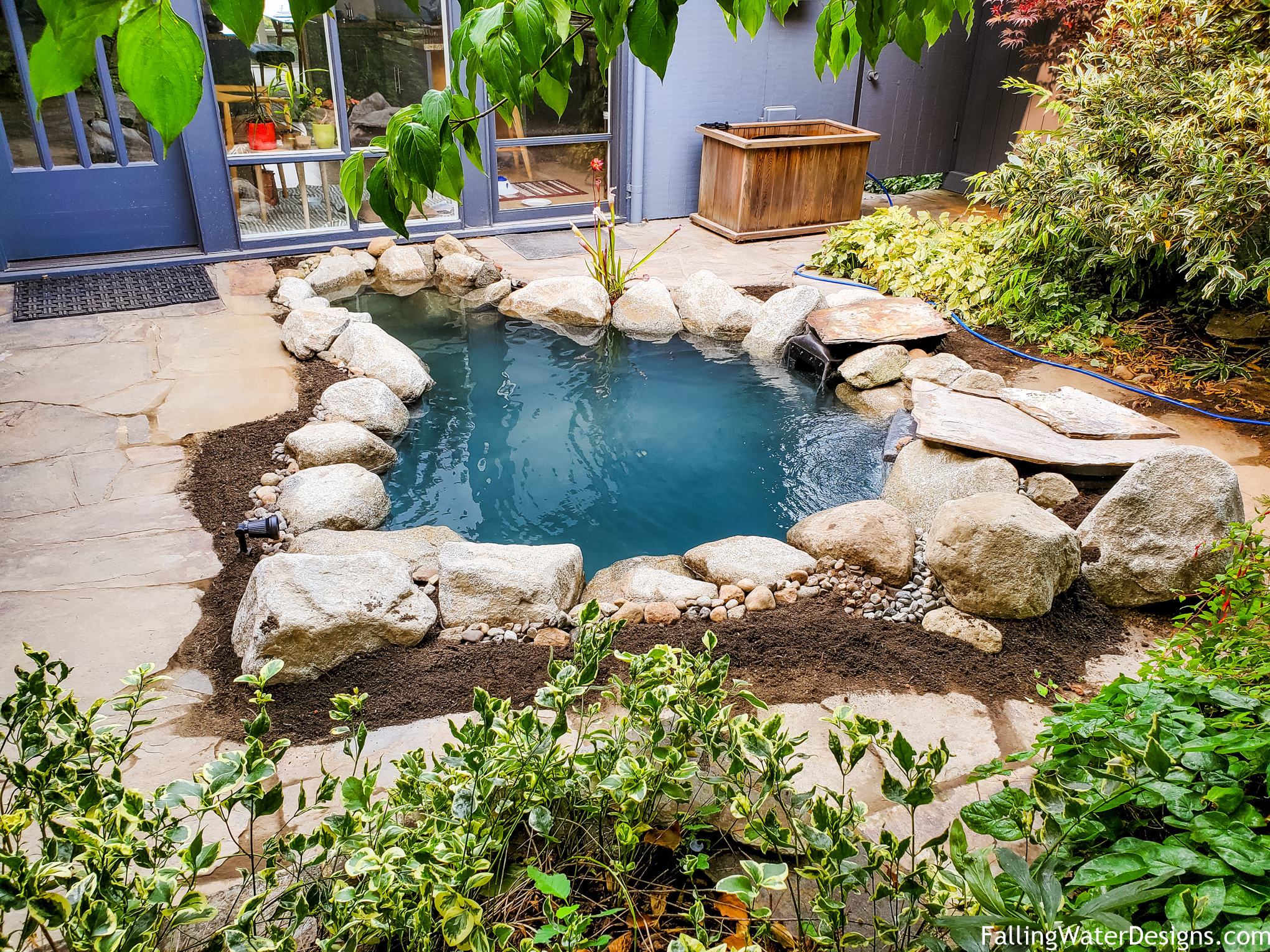 A Seattle installation of a Koi Pond and garden design by Falling Water Designs. ©Falling Water Designs